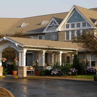 A beautiful residential building with well-maintained gardens and a welcoming entrance.
