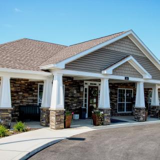 A modern suburban building with a brick exterior and large entrance.