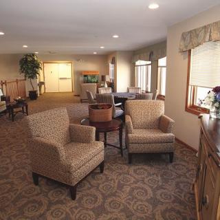 A cozy living room with comfortable seating and elegant decor.