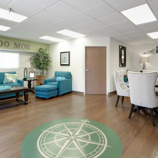 Modern office waiting area with comfortable seating and stylish decor.