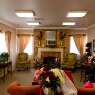 A cozy living room with a fireplace and comfortable seating.