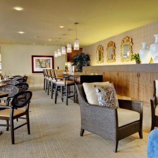 A cozy seating area with a bar counter and decorative elements.