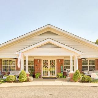 A welcoming residential building with a prominent entrance and front porch.