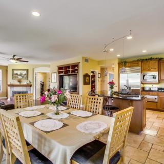 A cozy open-concept living and dining area with a fully equipped kitchen.