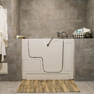 A modern bathroom featuring a walk-in tub, designed for accessibility and comfort.