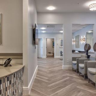 A modern reception area with stylish decor and comfortable seating.