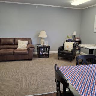 A cozy living room setup featuring comfortable seating and a welcoming atmosphere.