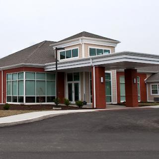 A modern healthcare facility with large windows and a welcoming entrance.