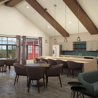 A modern kitchen and dining area featuring wood beams, contemporary furniture, and pendant lighting.