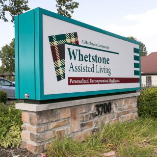 A sign for Whetstone Assisted Living in front of the facility.
