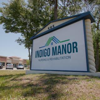 Sign for Indigo Manor, a healthcare and rehabilitation facility.