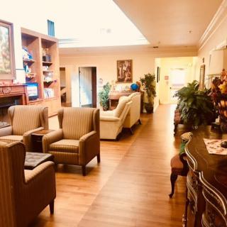 A cozy lounge area with comfortable seating and warm decor.
