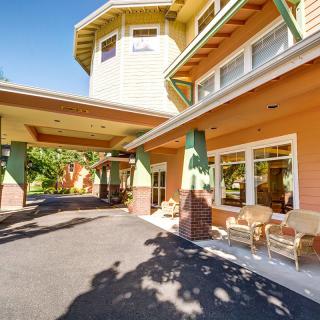 A welcoming entrance to a residential building with a covered porch area.