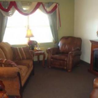 Cozy living room with comfortable seating and warm lighting.