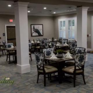 A cozy dining room with elegantly set tables and chairs.