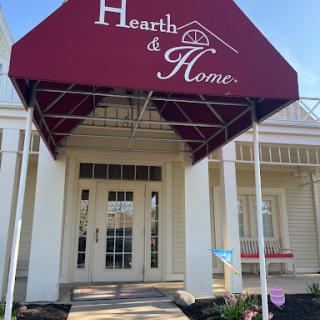 The welcoming entrance to Hearth & Home, featuring a stylish awning.