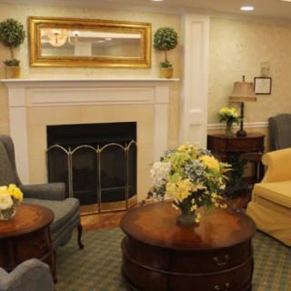 A cozy living room with a fireplace and comfortable seating.