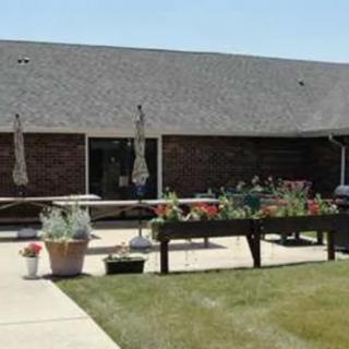 A building with an outdoor garden area and potted plants.
