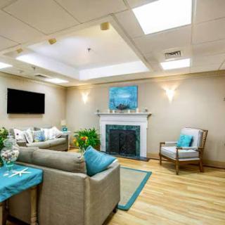 A cozy and modern living room with a welcoming atmosphere, featuring comfortable seating and a stylish fireplace.