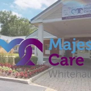 The entrance of a healthcare facility with 'Majestic Care Whitenaut' signage and logo.