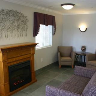 Cozy living room with a fireplace and comfortable seating.