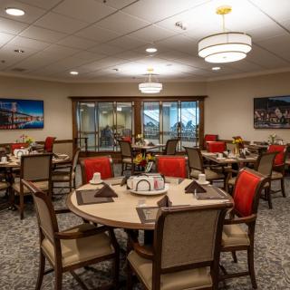 An inviting dining area with neatly arranged tables and comfortable seating.