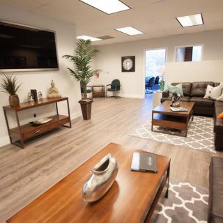 Modern office lobby with comfortable seating and stylish decor.