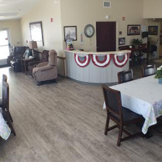 A spacious community lounge and dining area with comfortable seating and decorative elements.