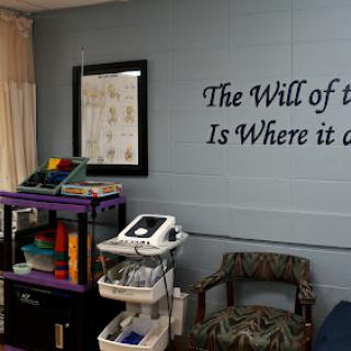 An inviting therapy space featuring an inspirational quote on the wall.