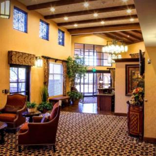 A warmly decorated lobby with comfortable seating and ambient lighting.