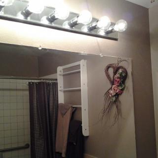 A bathroom mirror adorned with a spooky decoration, creating a Halloween prank scene.