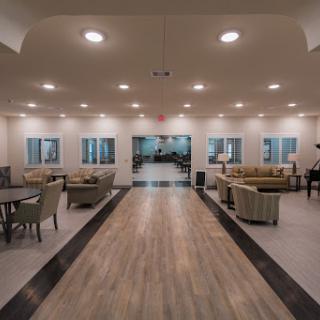 A spacious and modern lobby featuring comfortable seating and stylish lighting.