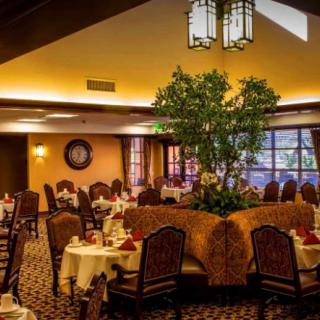 Cozy restaurant dining area with elegant decor and ambient lighting.