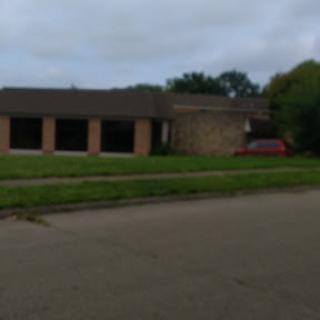An abandoned building captured on a cloudy day.