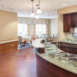 Modern dining area with buffet counter and seating.
