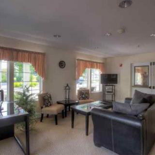 A cozy living room with elegant furnishings and natural light.