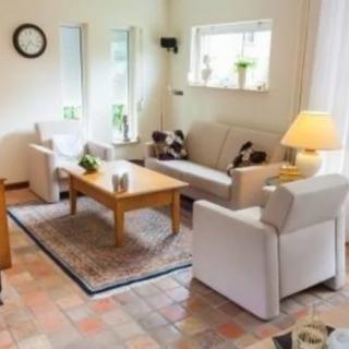 Cozy living room with comfortable seating and warm lighting.