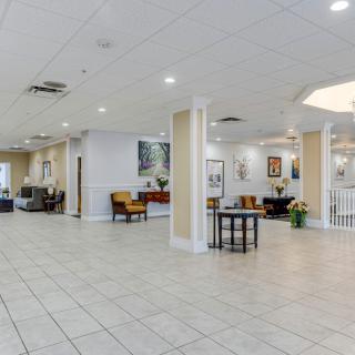 A spacious lobby area with comfortable seating and bright lighting.