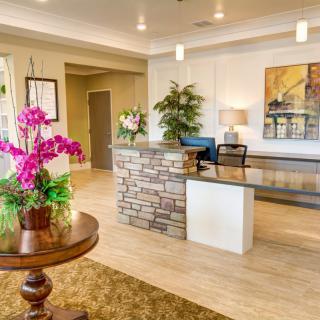 A welcoming reception area with floral arrangements and modern decor.