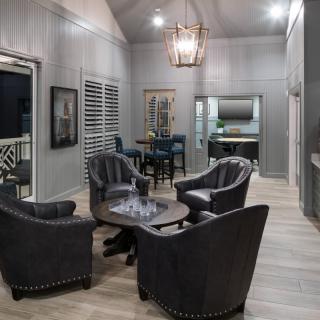A modern living room with stylish furniture and elegant lighting.