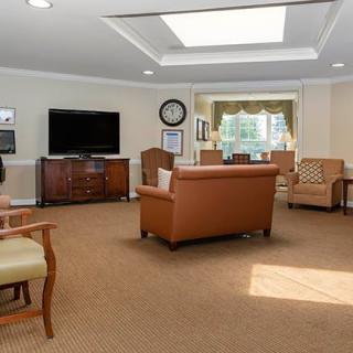 A cozy living room with comfortable seating and a television.