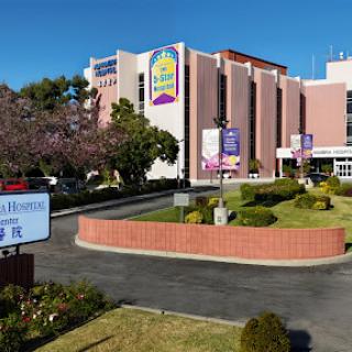A view of a healthcare facility showcasing its entrance and signage.