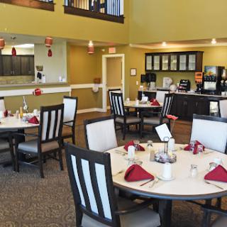 A contemporary dining area set up for patrons, featuring elegantly arranged tables and a cozy atmosphere.