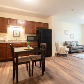Open-plan kitchen and living area with modern furnishings.