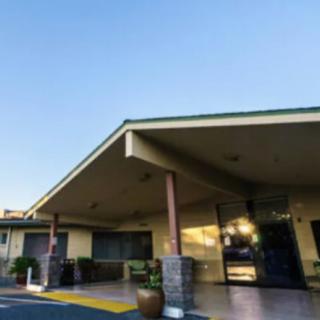 The entrance of a motel at sunset.