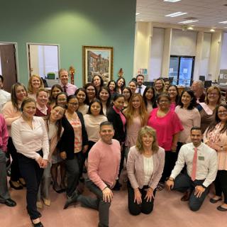 Team gathering in the office, showcasing camaraderie and support.