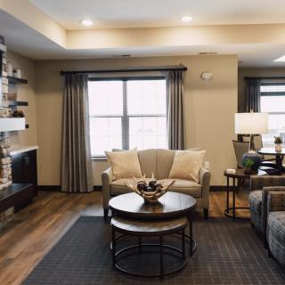 A cozy living room with modern decor and comfortable seating.
