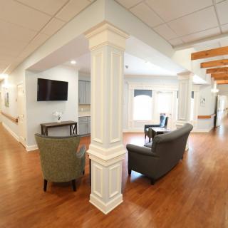 A cozy lounge area with comfortable seating and a television.
