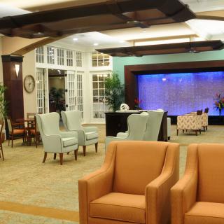 A comfortable lobby area with various seating options and ambient lighting.