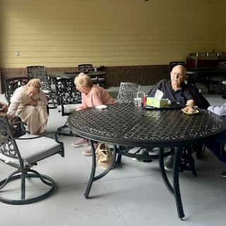 Seniors enjoying a moment together outdoors.